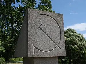 Sickle Prints: monument with a sickle and hammer, communist symbol of the Soviet Union