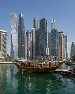 Dubai Skyline Prints: Morning shot of the Dubai Marina skyline along with a docked boat