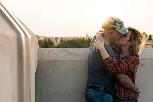 Intimacy Prints: Morocco, Marrakesh, couple kissing at sunset