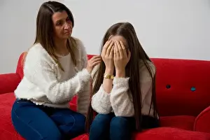 45 50 Years Prints: Mother comforting her sad teenage daughter