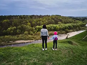 Local Travel Prints: Mother and daughter enjoys the view on the coast Sluch river hills
