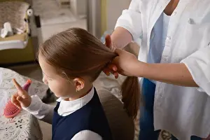 Daughter Prints: Mother preparing daughter's hair for school on a busy morning