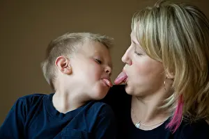 Posed Prints: Mother and son sticking tongue out