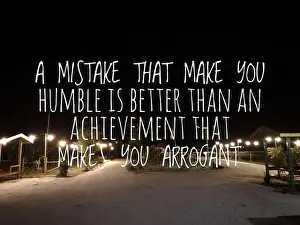 Motivational Prints: Motivational and inspirational quote with phrase A MISTAKE THAT MAKE YOU HUMBLE IS BETTER THAN AN ACHIEVEMENT THAT