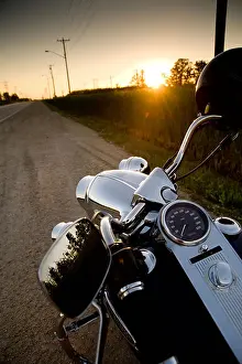 Beams Prints: Motorcycle parked on the side of the road at sunset