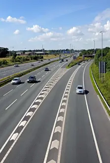 Joining Prints: motorway with old style central reservation barrier before upgrade in safety standards