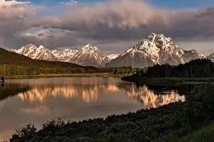 Mount Moran and the Grand Teton mountains at Oxbow Bend reflected at dawn on the Snake River at the Grand Teton
