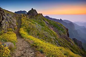 Mountain hiking trail from Pico do Arieiro to Pico Ruivo before sunrise, Madeira Island, Portugal