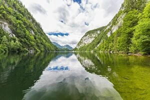 Images Dated 25th July 2017: Mountain lake landscape, beautiful scenery with clouds and pine trees over lake reflection