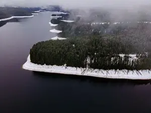 Bad Weather Prints: Mountain lake photography in winter season, shot from a drone