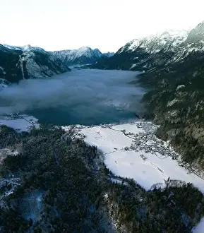 Mountain and Lake Winter Landscape at the Grundlsee in Austria