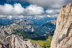 Mountain landscape from Marmolada mountain peak in italian alps against blue sky