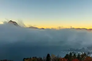 Lugano Prints: Mountain Peak San Salvatore Above Cloudscape and Lake Lugano with Sunlight and Clear Sky in City of Lugano