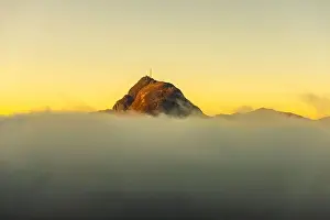 San Salvatore Prints: Mountain Peak San Salvatore Above Cloudscape with Sunlight and Clear Sky in Lugano