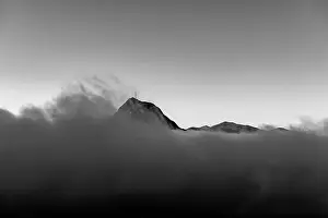 Lugano Prints: Mountain Peak San Salvatore Above Cloudscape with Sunlight and Clear Sky in Lugano