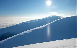 Snow Peak Prints: Mountain winter landscape. Colored dawn over the snow-capped mountains. Drone view