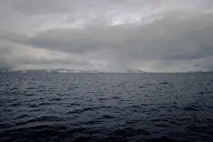 Brim Prints: Mountains by the arctic ocean in the distance in northern Norway in winter
