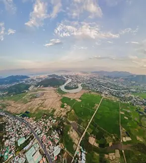 Trang Prints: Mountains, river and city of Nha Trang, view from a drone