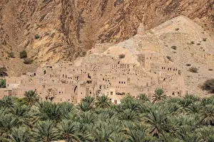 Oman Prints: Mud-brick ruins and date palms in the oasis village of Birkat al Mouz, Oman