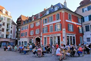 Cobblestone Prints: Mulhouse, Alsace in France - August 22 2024: people enjoy the architecture in the streets of the town