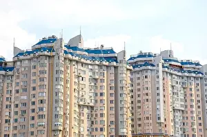 Multi Storey Prints: Multi-storey building construction on a background of blue sky