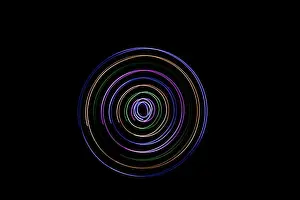 Twirl Prints: Multicolored circles on a black background