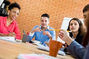 Interracial Prints: Multiethnic casual business people in the meeting