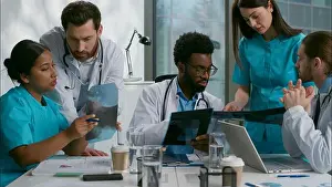 Checkup Prints: Multiethnic doctors medical diagnostic team meeting heath research xray analyzing African men Indian Caucasian women