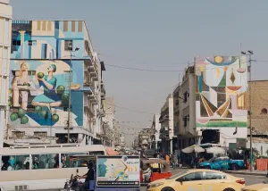 Middle East Prints: A mural by Iraqi painter Wijdan al-Majed on a house in the Al-Sadriya neighborhood of Baghdad portrays the bustling