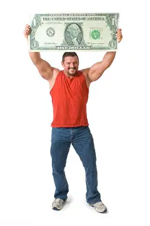 Forties Prints: Muscular man holding oversized dollar bill over his head