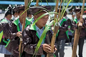 Adult Woman Prints: Musicians playing bamboo wind instruments at celebration