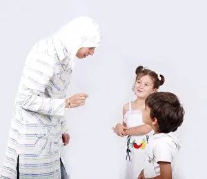 Veil Prints: Muslim mother and her children