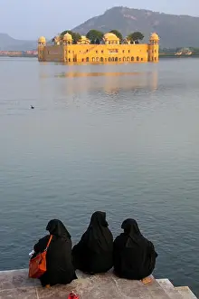 Old Palace Prints: Muslim women sitting on the shore of Man Sagar Lake in Jaipur, Rajasthan, India