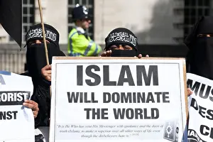 Veil Prints: Muslim women wearing the niqab demonstrating for Muslim domination of the world in London