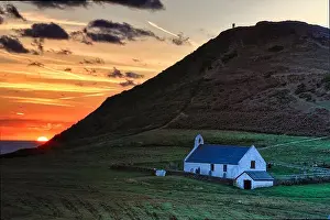 Hillside Prints: Mwnt is a secluded cove on the ceredigion coast above a beautiful beach is the 14th century Holly cross church
