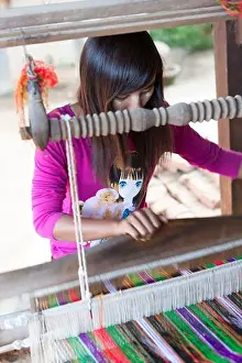 Weaving Prints: Myanmar, Bagan, young woman weaving.