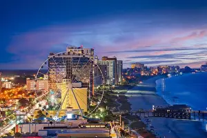 Myrtle Beach, South Carolina, USA city skyline on the beach at dusk