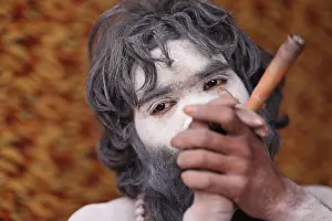 Hindu Festival Prints: Naga sadhu smoking in an akhara