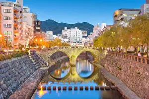 Nagasaki, Japan cityscape with Megane Spectacles Bridge at dusk