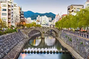 Nagasaki, Japan cityscape with Megane Spectacles Bridge at dusk