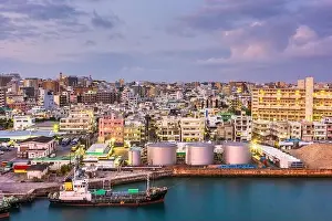Naha, Okinawa, Japan industrial cityscape along Tomari Port at twilight