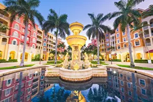 Naples, Florida, USA town skyline and city plaza at twilight