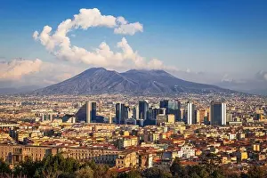 Naples, Italy with the financial district skyline under Mt. Vesuvius in the afternoon