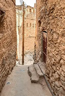 Oman Prints: Narrow alleyway in the old mountain village Misfat Al Abriyeen in Sultanate of Oman