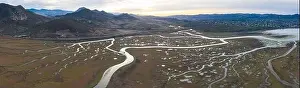 Narrow channels meander through a beautiful estuary in Central California. Estuaries form when freshwater runoff meets and mixes with seawater