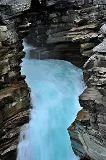Rushing Water Prints: A narrow passage cut through the rock walls by the flowing water of the Athabasca river