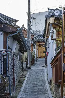 Old House Prints: Narrow paved alley in a traditional neighborhood with old houses, Seoul, South Korea