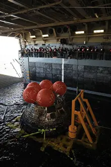 Descent Prints: NASA recovered the Orion spacecraft for Artemis I inside the USS Portland well deck on Dec