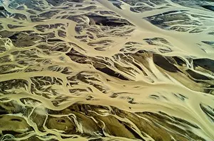 Brownish Prints: Natural background - Aerial view of braided glacial River in Iceland