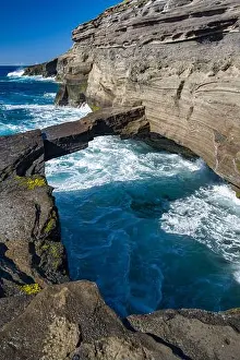Breaking Prints: Natural bridge over small inlet on the rugged coast of Koko Head